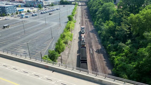 Aerial view of train passing under bridge