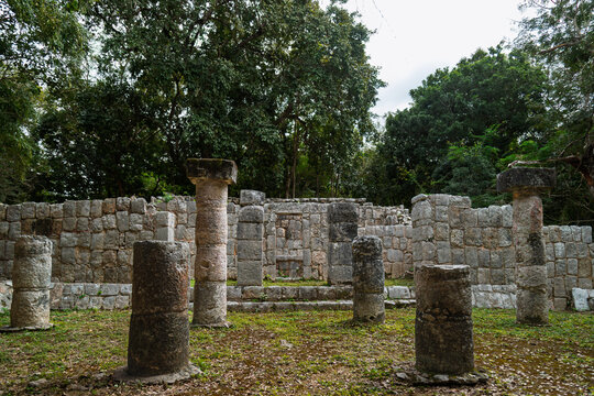 View of the Xtoloc Temple with stone columns and central altar hidden in the jungle at Chichen Itza, Mexico