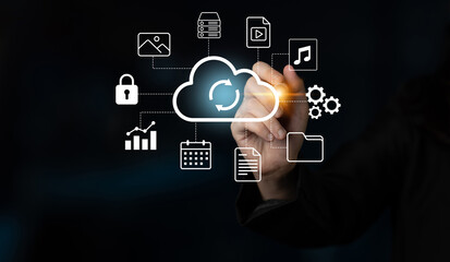 Obraz premium An individual interacts with a virtual cloud icon, showcasing various data elements that emphasize the functionality of cloud technology in digital management and services. Gantry