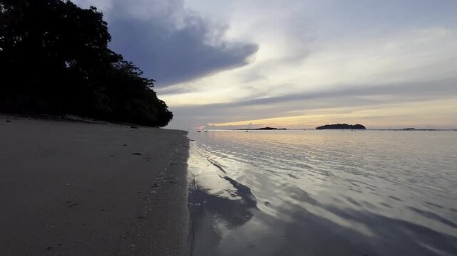 Tropical Beach at Sunset with Calm Ocean