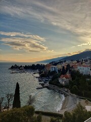 Fototapeta premium Panoramic sunset view of Opatija, Croatia, with marina, Adriatic Sea and mountains