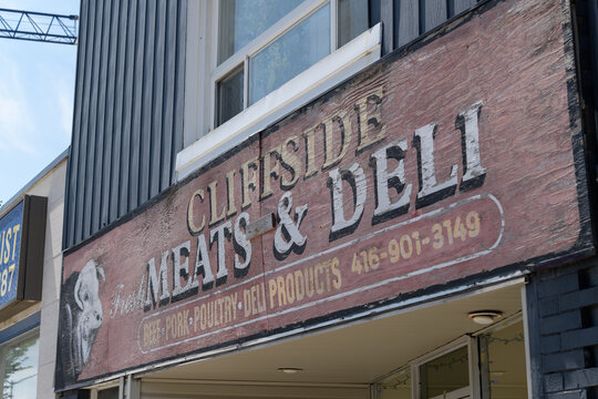 old painted sign on the exterior of Cliffside Meat & Deli, a butcher shop and deli, located at 2476 Kingston Rd, Scarborough, Toronto