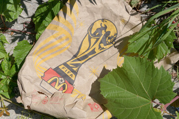 Obraz premium discarded McDonald's Canada paper bag with FIFA World Cup trophy logo in Toronto