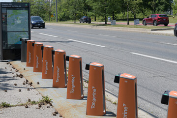 Obraz premium wide, perspective view of a Bike Share Toronto docking station (without rental vehicles) at Kingston Rd and Scarborough Golf Club Rd