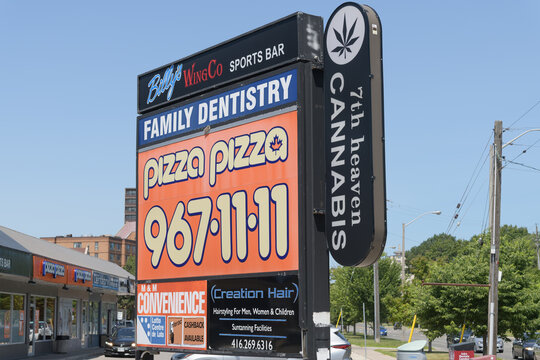 road side pylon sign at Kingston Rd and Markham Rd, Scarborough, Toronto (Billy's Wing Co, Pizza Pizza, 7th Heaven Cannabis)