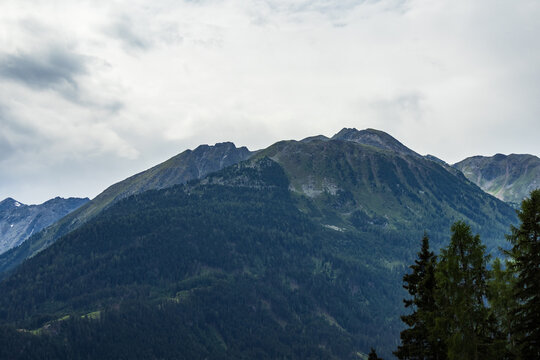 Mountain Peaks and Forested Slopes under Cloudy Sky, Austria, Tyrol, Braunschweiger H&uuml;tte, 29 June 2026