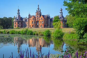 Obraz premium Ooidonk Castle / Kasteel van Ooidonk, 16th century Flemish Renaissance moated castle at Sint-Maria-Leerne in summer, Deinze, East Flanders, Belgium