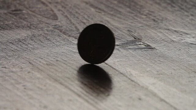 A single 2 euro coin spinning on its edge, representing chance and decision, capturing the uncertainty of a flip and the concept of heads or tails