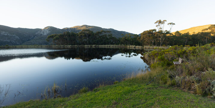 sunset light upon pond and Klein Mountains, Stanford, South Africa