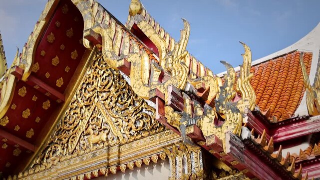Ornate Temple Gabled Roof With Gold Carvings And Decorative Dragon Finials