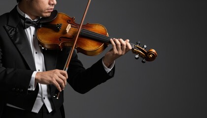 Fototapeta premium Professional Violinist Performing in Formal Tuxedo