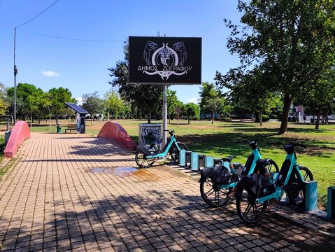 Photo of an electric bike sharing station in Goudi Metropolitan Park (Parko Stratou), located in the Zografou district of Attica, Greece.