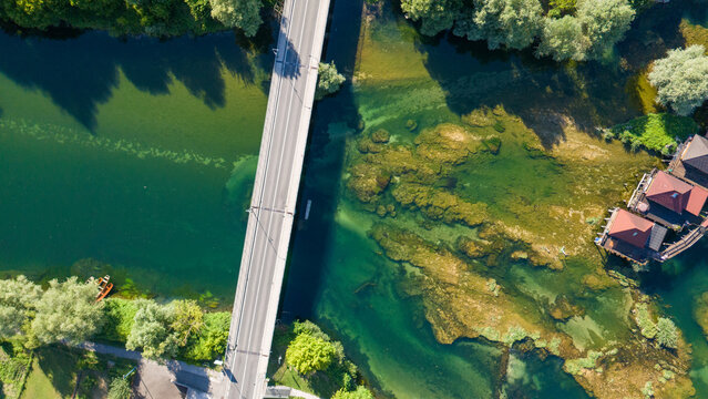 Top down aerial view of bridge over turquoise Una river in Bosnia and Herzegovina 