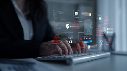 Naklejka na ściany i meble A business professional engages with a digital interface, revealing cybersecurity threats and alerts, enhancing data security and risk management in a modern office setting. Ledger