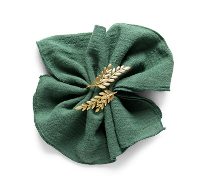 Folded green linen napkin with golden olive branch napkin ring, elegant table setting and dinnerware accessory, isolated on a white background