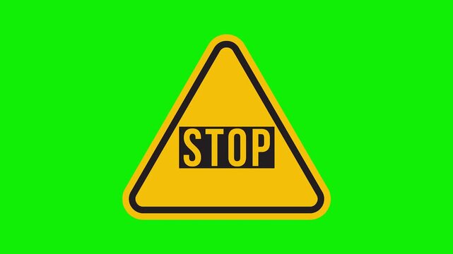 Yellow triangular warning sign with the word STOP on a green screen background.