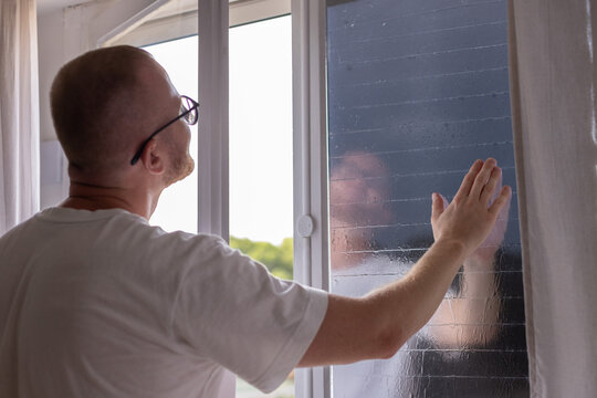 Installing Heat Control Window Tint to Protect Home from Summer Sun.