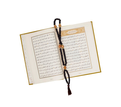 Quran with wooden prayer beads isolated PNG on transparent background, Islamic holy book and religious worship symbol