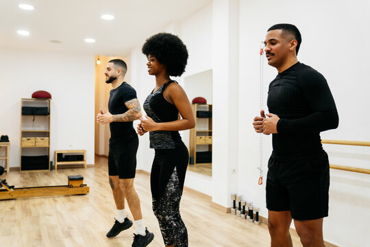 Friends exercising together in a fitness studio