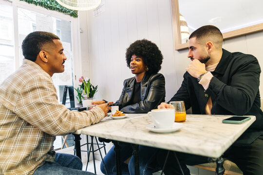 Friends enjoying a casual coffee break together