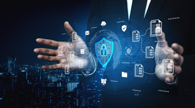 A businessman showcases a digital cybersecurity concept with protective icons and a shield, illustrating modern technology against a vibrant city skyline at night. Ledger