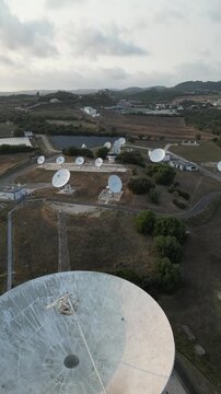 Aerial view of satellite ground station with parabolic antennas