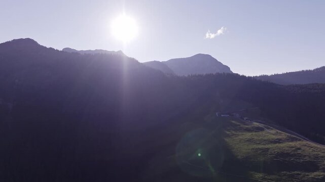Aerial View of Alpine Farmhouses Framed by a Dramatic Mountain Range. Achenkirch, Austria