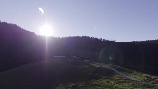 Aerial View of Alpine Farmhouses Framed by a Dramatic Mountain Range. Achenkirch, Austria