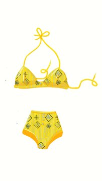 A two-piece bathing suit is shown with a yellow top and bottom. The design includes patterns in blue and black. This swimwear is ideal for beach days or pool parties.