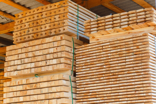 Piles of wooden boards in the sawmill, planking.