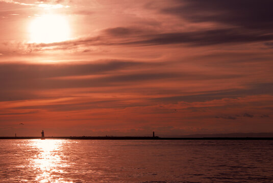 Beautiful Autumn Evening Sky and Ocean View with Lighthouse Silhouette in Kushiro
