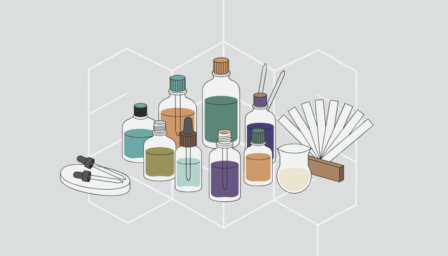 Collection of glass perfume bottles and test strips arranged on a table for fragrance testing.