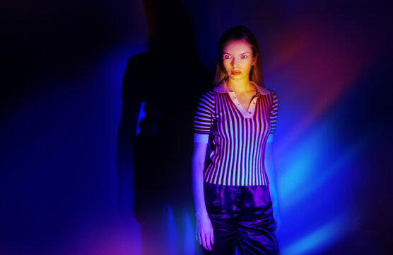 Striking fashion portrait in vibrant neon light