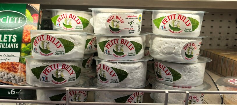 Fresh French Goat Cheese Displayed in Supermarket Refrigerator 