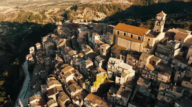 Aerial footage of Badolato hilltop town and Mediterranean coast