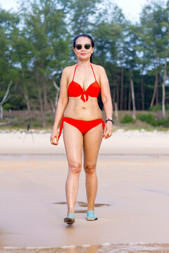Woman with red bikini relax on beach