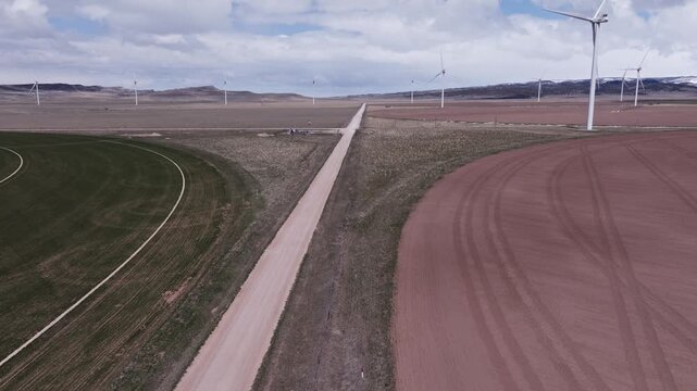 Aerial View of a Wind Farm Amid Farmland on the Rural Plains of Bridger, Montana