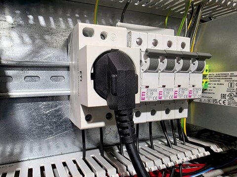 Circuit Breaker and Electrical Plug Assembled in a Modern Control Panel