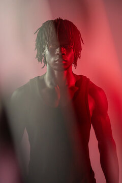 African man portrait with red light and smoke