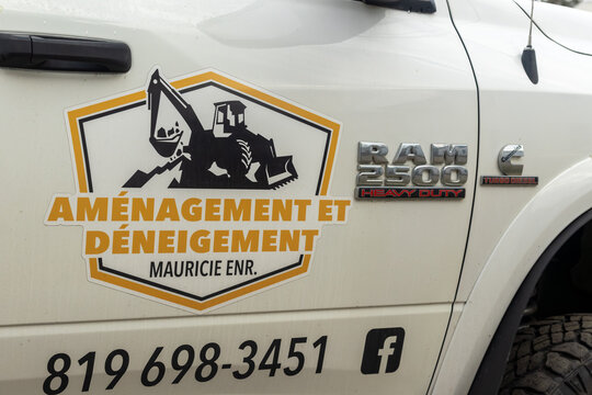 La Tuque, Quebec, 08 May 2026 : White Ram  Heavy Duty truck displays a logo for Mauricie ENR landscaping and snow removal services.