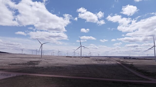 Aerial View of a Wind Farm Amid Farmland on the Rural Plains of Bridger, Montana