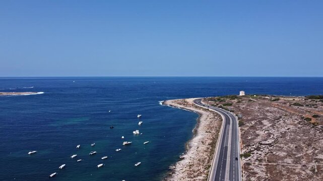 Naxxar, Malta 25.07.2026 - Aerial view of Salina bay, coast road and Torri tal-Ghallis - Ghallis Watch Tower.