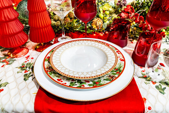Festive Christmas dinner table setting with red decor