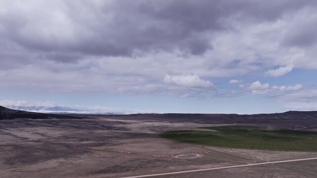 Aerial View of a Wind Farm Amid Farmland on the Rural Plains of Bridger, Montana