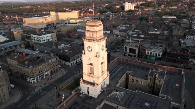 Close up aerial flyby of Barnsley Town Hall clock tower in daylight. Aerial footage, 4k. 