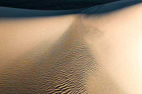 Abstract sand dune pattern with rippled texture background