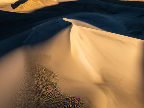 Abstract sand dune pattern with textured desert background