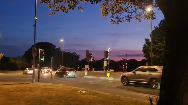 Low Angle Illuminated Streets View of Luton City of England United Kingdom During Orange Sunset Evening. Wide Angle Camera Footage Was Captured During Walk at Night of July 23rd, 2026.