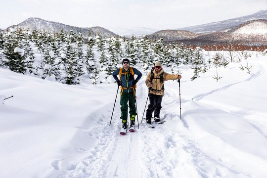 Backcountry touring on splitboard in snowy Japan