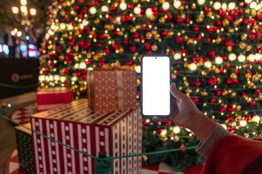 Christmas shopping concept with smartphone and gift boxes